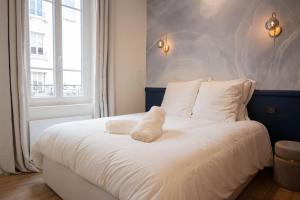Llit o llits en una habitació de Villa La Roseraie