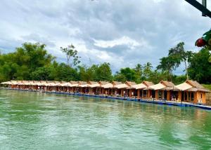 a row of huts on the water on a boat at m&r house 