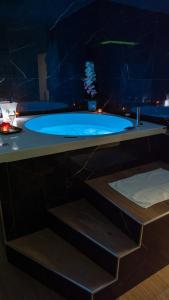 a bathroom with a blue tub in a room at SUITE Meghan home in Catania +51 photos