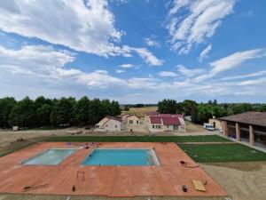 an overhead view of a swimming pool in a yard at Incanto Glamping village in Savio di Ravenna
