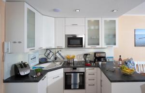 Kuchyň nebo kuchyňský kout v ubytování Lichtdurchflutete Ferienwohnung mit Südbalkon
