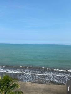 a view of the ocean from a beach at Apartment Marbella Anyer in Serang