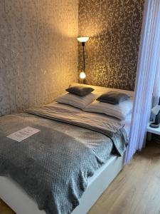 Posteľ alebo postele v izbe v ubytovaní Apartament Czytelnia - parking gratis