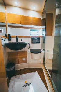 a small bathroom with a sink and a toilet at DiscoverBoat - Pita - Exclusive Boat&Breakfast in Bari