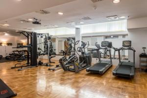 a gym with treadmills and elliptical machines at Annex building of Art Hotel in Split
