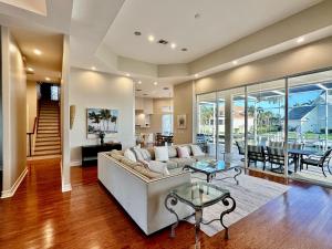 a living room with a couch and a table at Luxury Rental Walkable To Beach With Wide Water Views I Pet Friendly in Henry Key