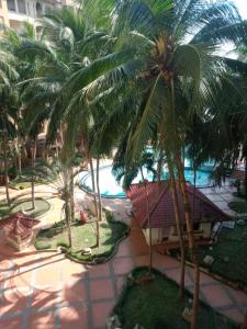 an aerial view of a resort with palm trees at Apartment Marbella Anyer in Serang