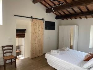 Postel nebo postele na pokoji v ubytování Ca Baruffa B&B