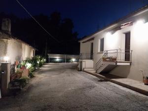 an empty parking lot of a building at night at Affittacamere Dolce Miele in Foligno