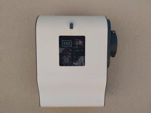 a white lightswitch on a wall with a picture on it at Affittacamere Dolce Miele in Foligno