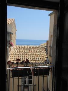 a view from a window of a building with a roof at Mareluna in Siracusa