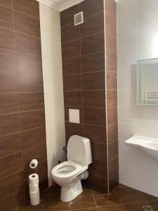 a bathroom with a toilet and a sink at Vacation house in Pravets golf resort At Pravets Lake in Pravets