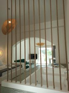 a living room with a bed and a table at Ιόνια Γαλήνη Pool Spa Suite in Parga