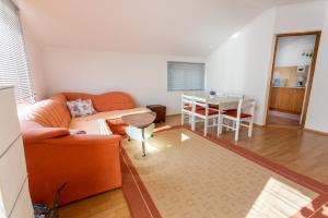 a living room with a couch and a table at Apartman Blagaj in Blagaj