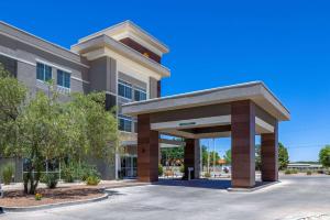 a building with a parking lot in front of it at La Quinta by Wyndham Artesia in Artesia