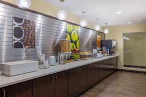 a bathroom with a counter with a sink and a counter at La Quinta by Wyndham Artesia in Artesia
