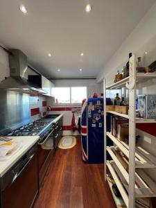 a kitchen with a stove and a counter top at Les Cigales in Le Pradet +32 photos