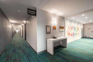 a corridor of a hospital with a sign on the wall at Home2 Suites By Hilton Quebec City in Quebec City