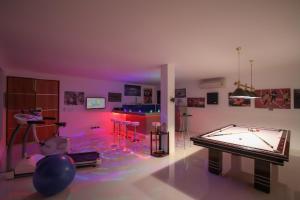 a room with a pool table and a ping pong ball at Serenity Villa in Bang Tao Beach