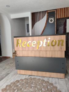 a reception sign for a rec department in a room at The Professor's Hotel in Bodrum City