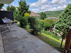 a view of a garden from the patio of a house at Ferienwohnung Starennest mit direktem Harzblick in Bad Lauterberg