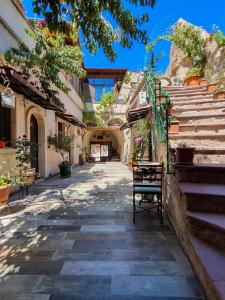 an alley with stairs and a bench in a building at Vintage Cave House Hotel in Goreme