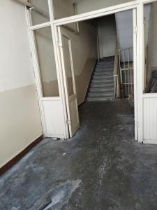an empty room with a staircase in a building at hilal in Erzurum