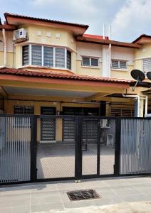 a black fence in front of a house at Homestay FourSeasons @ Bandar Baru Bangi in Bandar Baru Bangi