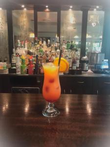 a drink sitting on a table in a bar at Admiral Hotel Villa Erme in Desenzano del Garda