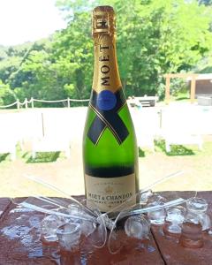 a bottle of champagne sitting on a table at PROVINCIALE 79 in Magreglio