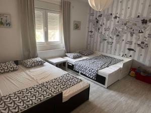 Postel nebo postele na pokoji v ubytování Vila Sava