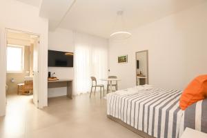 Кровать или кровати в номере Agorà Vieste Rooms & Apartments