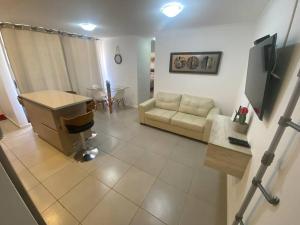 Cómodo departamento en Caldera, con piscina.的电视和/或娱乐中心