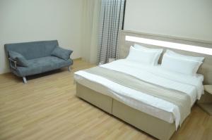 Letto o letti in una camera di Hotel Martini Kvariati