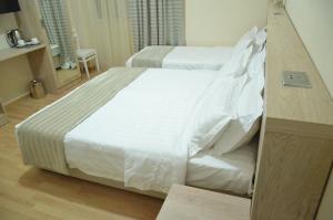 Letto o letti in una camera di Hotel Martini Kvariati