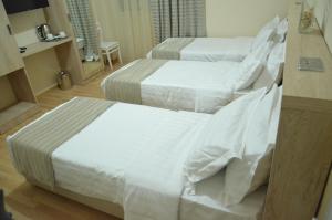 Letto o letti in una camera di Hotel Martini Kvariati