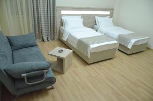 Letto o letti in una camera di Hotel Martini Kvariati