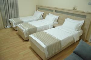 Letto o letti in una camera di Hotel Martini Kvariati