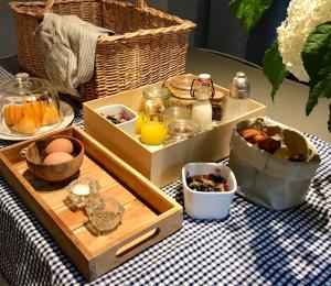 a table with a tray of food on a table at B&B La Ruelle in Profondeville