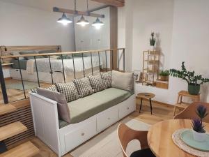 a living room with a couch and a bunk bed at Studio al Mulino in Rovinj