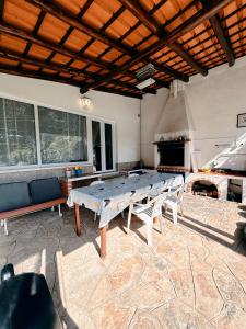 a large room with a table and a fireplace at Casa Girassol with a beautiful private Pool and Garden in Sintra