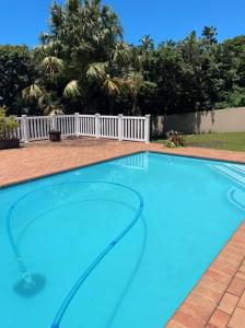 a large swimming pool with blue water at 373 on Bristol Home in Port Edward