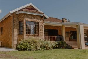 a brick house with a window and a porch at 373 on Bristol Home in Port Edward