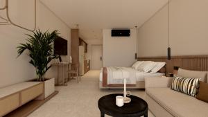 プラキアスにあるPaligremnos Infinityのベッドルーム1室(ベッド1台付)、リビングルーム(ソファ付)