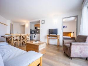 a living room with a bed and a dining room at Appartement 8 pers. Peyragudes avec piscine et proche des pistes - FR-1-695-27 in Germ