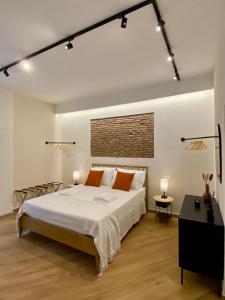 En eller flere senge i et værelse på Galatola Suite