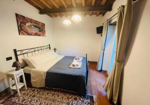 Postel nebo postele na pokoji v ubytování B&B Giardino delle Camelie