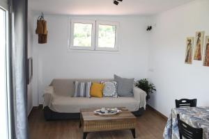 a living room with a couch and a table at Sergi Home in Raches
