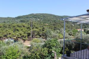 a view of a mountain from the balcony of a house at Sergi Home in Raches