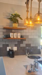 Afbeelding uit fotogalerij van Rock Away Beach Home in Hartenbos +11 foto's